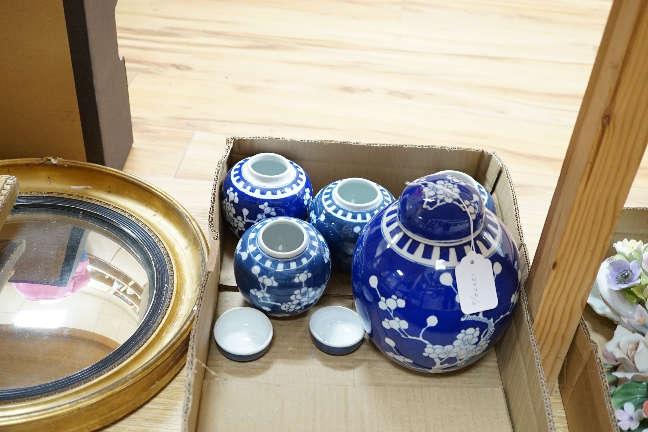 A collection of seven Chinese Prunus blossom jars, three with covers and two bowls